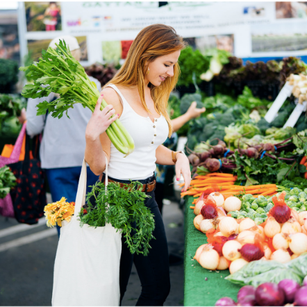 Ryann Kipping shopping for fresh produce at a farmers market
